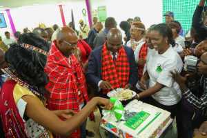 Safaricom CEO, Bob Collymore and Narok governor, Ole Tunai cutting the cake