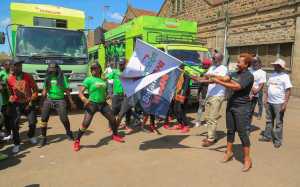 Safaricom Director Consumer Business Unit, Sylvia Mulinge (right) and Safaricom Regional Director- Sales and Operations, Steve Okeyo flag off the caravan after launching the Safaricom Mtaani - Bizna