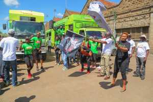 Safaricom Director- Consumer Business Unit, Sylvia Mulinge (right) and Safaricom Regional Director- Sales and Operations, Steve Okeyo flag off the caravan after launching the Safaricom Mtaani - Bizna