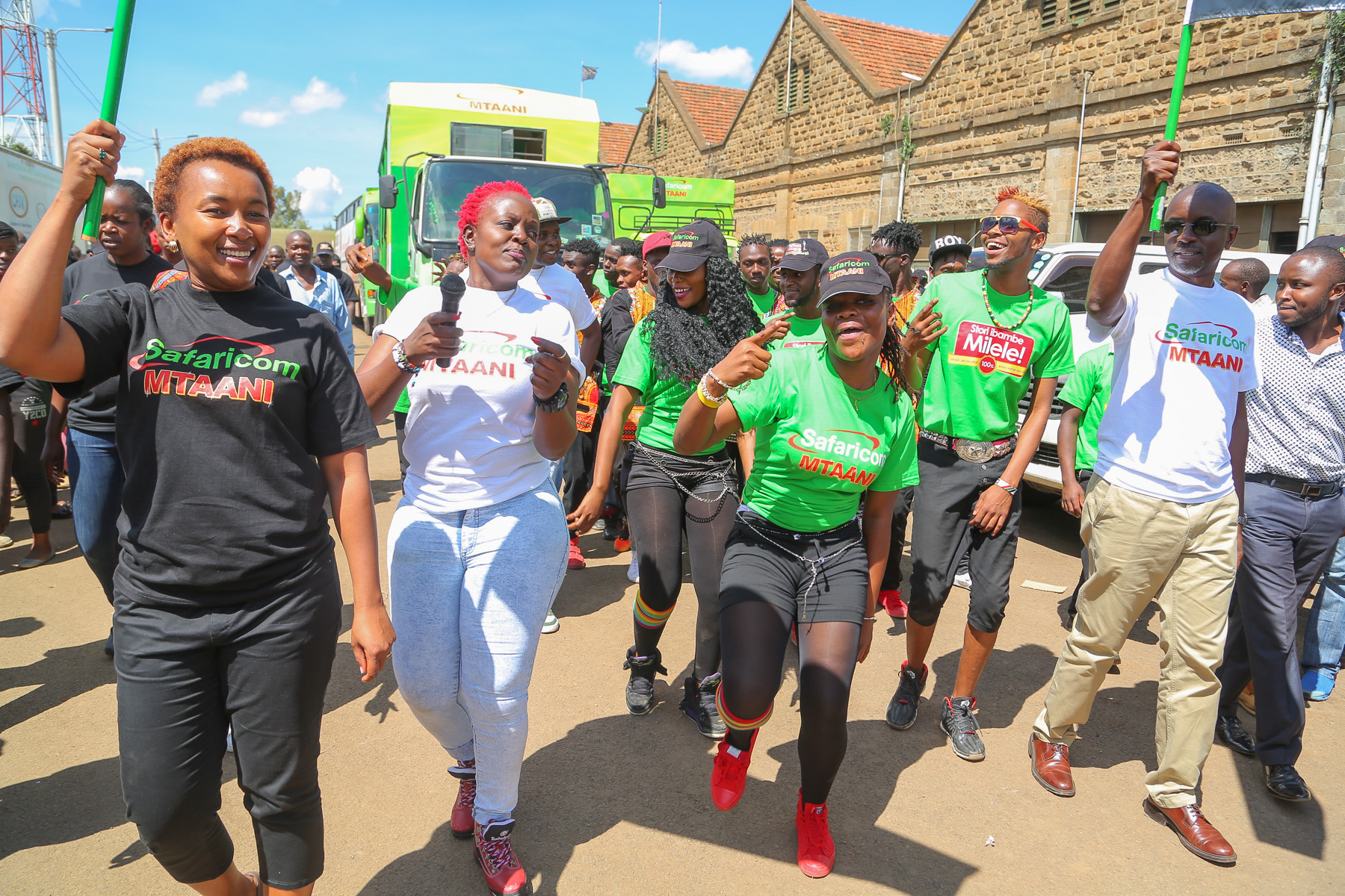 Safaricom Director - Consumer Business Unit, Sylvia Mulinge (right) and Safaricom Regional Director- Sales and Operations, Steve Okeyo flag off the caravan after launching the Safaricom Mtaani - Bizna