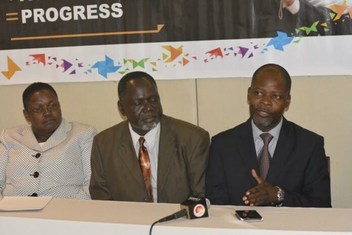 Enactus Kenya director James Shikwati (right) addresses the media as Dr Risper Orero of KEMU and Zetech Vice Chancellor Prof Edwin Wamukoya look on - Bizna