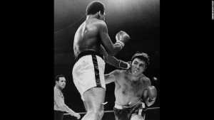 On November 2, 1970, Ali returned to the ring for his first professional fight in three years. He defeated Jerry Quarry in the third round. Hide Caption 24 of 50 Known as the "Fight of the Century," Ali and Joe Frazier split a $5 million purse to fight for Frazier's title on March 8, 1971, in New York. Frazier won by unanimous decision, handing Ali his first professional loss. Photos: Boxing legend Muhammad Ali Known as the "Fight of the Century," Ali and Joe Frazier split a $5 million purse to fight for Frazier's title on March 8, 1971, in New York. Frazier won by unanimous decision, handing Ali his first professional loss. Hide Caption 25 of 50 Ali toys with the finely combed hair of television sports commentator Howard Cosell before the start of the Olympic boxing trials in August 1972. Photos: Boxing legend Muhammad Ali Ali toys with the finely combed hair of television sports commentator Howard Cosell before the start of the Olympic boxing trials in August 1972. Hide Caption 26 of 50 Ali and Frazier appear on "The Dick Cavett Show" in January 1974. The two got into a brawl in ABC's New York studio and were fined $5,000 each. Photos: Boxing legend Muhammad Ali Ali and Frazier appear on "The Dick Cavett Show" in January 1974. The two got into a brawl in ABC's New York studio and were fined $5,000 each. Hide Caption 27 of 50 Ali passes a cheering crowd in Kinshasa, Zaire (now the Democratic Republic of Congo), on September 28, 1974. Ali was in the country to fight George Foreman, who had recently defeated Frazier to win the title. Photos: Boxing legend Muhammad Ali Ali passes a cheering crowd in Kinshasa, Zaire (now the Democratic Republic of Congo), on September 28, 1974. Ali was in the country to fight George Foreman, who had recently defeated Frazier to win the title. Hide Caption 28 of 50 Ali and Foreman fight October 30, 1974, in what was billed as <a href="http://www.cnn.com/2014/10/30/worldsport/gallery/rumble-in-the-jungle-40-years/index.html" target="_blank">"The Rumble in the Jungle."</a> Ali, a huge underdog, knocked out Foreman in the eighth round to regain the title that was stripped from him in 1967. Photos: Boxing legend Muhammad Ali Ali and Foreman fight October 30, 1974, in what was billed as "The Rumble in the Jungle." Ali, a huge underdog, knocked out Foreman in the eighth round to regain the title that was stripped from him in 1967. Hide Caption 29 of 50 Ali addresses a Nation of Islam meeting in London in December 1974. The following year, Ali left the Nation and embraced a more mainstream Islamic faith. Photos: Boxing legend Muhammad Ali Ali addresses a Nation of Islam meeting in London in December 1974. The following year, Ali left the Nation and embraced a more mainstream Islamic faith. Hide Caption 30 of 50 Ali offers advice to future opponent Richard Dunn in March 1976. Ali defeated Dunn in the fifth round two months later. It was his last knockout win. Photos: Boxing legend Muhammad Ali Ali offers advice to future opponent Richard Dunn in March 1976. Ali defeated Dunn in the fifth round two months later. It was his last knockout win. Hide Caption 31 of 50 Ali and his third wife, Veronica, second from right, visit the Kremlin in Moscow in June 1978. The two were married from 1977 to 1986. Ali has been married four times. Photos: Boxing legend Muhammad Ali Ali and his third wife, Veronica, second from right, visit the Kremlin in Moscow in June 1978. The two were married from 1977 to 1986. Ali has been married four times. Hide Caption 32 of 50 Ali takes a hit from Leon Spinks during their title fight in New Orleans on September 15, 1978. Ali won by unanimous decision, regaining the title he lost to Spinks earlier that year. Photos: Boxing legend Muhammad Ali Ali takes a hit from Leon Spinks during their title fight in New Orleans on September 15, 1978. Ali won by unanimous decision, regaining the title he lost to Spinks earlier that year. Hide Caption 33 of 50 Ali sits with his daughters Laila and Hana at the Grosvenor House in London in December 1978. He briefly retired from professional boxing the following year. Photos: Boxing legend Muhammad Ali Ali sits with his daughters Laila and Hana at the Grosvenor House in London in December 1978. He briefly retired from professional boxing the following year. Hide Caption 34 of 50 Ali came out of retirement on October 2, 1980, for a title fight with Larry Holmes and a guaranteed purse of $8 million. Holmes won easily, beating up Ali until the fight was stopped after the 10th round. Photos: Boxing legend Muhammad Ali Ali came out of retirement on October 2, 1980, for a title fight with Larry Holmes and a guaranteed purse of $8 million. Holmes won easily, beating up Ali until the fight was stopped after the 10th round. Hide Caption 35 of 50 Ali and Trevor Berbick weigh in for their fight in the Bahamas in December 1981. Berbick won by unanimous decision. It was Ali's last professional fight. Photos: Boxing legend Muhammad Ali Ali and Trevor Berbick weigh in for their fight in the Bahamas in December 1981. Berbick won by unanimous decision. It was Ali's last professional fight. Hide Caption 36 of 50 Ali prays at a mosque in Cairo in October 1986. Two years prior, he revealed that he had Parkinson's syndrome, a disorder of the central nervous system. Photos: Boxing legend Muhammad Ali Ali prays at a mosque in Cairo in October 1986. Two years prior, he revealed that he had Parkinson's syndrome, a disorder of the central nervous system. Hide Caption 37 of 50 In 1990, Ali met with Iraqi President Saddam Hussein to negotiate the release of 15 American hostages in Iraq and Kuwait. Here, Ali leaves Iraq with the hostages on December 2, 1990. Photos: Boxing legend Muhammad Ali In 1990, Ali met with Iraqi President Saddam Hussein to negotiate the release of 15 American hostages in Iraq and Kuwait. Here, Ali leaves Iraq with the hostages on December 2, 1990. Hide Caption 38 of 50 Ali lights the Olympic torch at the 1996 Summer Olympics in Atlanta. Photos: Boxing legend Muhammad Ali Ali lights the Olympic torch at the 1996 Summer Olympics in Atlanta. Hide Caption 39 of 50 Juan Antonio Samaranch, president of the International Olympic Committee, gives Ali a replacement gold medal in 1996. Ali had thrown his 1960 gold medal into the Ohio River after he was criticized for not fighting in Vietnam. Photos: Boxing legend Muhammad Ali Juan Antonio Samaranch, president of the International Olympic Committee, gives Ali a replacement gold medal in 1996. Ali had thrown his 1960 gold medal into the Ohio River after he was criticized for not fighting in Vietnam. Hide Caption 40 of 50 Ali and his fourth wife, Lonnie, unveil his special-edition Wheaties box in February 1999. The box marked the cereal's 75th anniversary, and it was the first time a boxer appeared on the cover. Photos: Boxing legend Muhammad Ali Ali and his fourth wife, Lonnie, unveil his special-edition Wheaties box in February 1999. The box marked the cereal's 75th anniversary, and it was the first time a boxer appeared on the cover. Hide Caption 41 of 50 Actor Arnold Schwarzenegger raises Ali's hand during the Celebrity Fight Night charity event in Phoenix in March 2002. Schwarzenegger was presented with the Muhammad Ali Humanitarian Award for his work with the Muhammad Ali Parkinson Research Foundation, the Inner-City Games Foundation and the Special Olympics. The award was presented by former CNN host Larry King, left. Photos: Boxing legend Muhammad Ali Actor Arnold Schwarzenegger raises Ali's hand during the Celebrity Fight Night charity event in Phoenix in March 2002. Schwarzenegger was presented with the Muhammad Ali Humanitarian Award for his work with the Muhammad Ali Parkinson Research Foundation, the Inner-City Games Foundation and the Special Olympics. The award was presented by former CNN host Larry King, left. Hide Caption 42 of 50 Ali arrives in Kabul, Afghanistan, in November 2002 for a three-day goodwill mission as a special guest of the United Nations. He was appointed as a U.N. Messenger of Peace in 2000. Photos: Boxing legend Muhammad Ali Ali arrives in Kabul, Afghanistan, in November 2002 for a three-day goodwill mission as a special guest of the United Nations. He was appointed as a U.N. Messenger of Peace in 2000. Hide Caption 43 of 50 U.S. President George W. Bush presents Ali with the Presidential Medal of Freedom, the nation's highest civilian honor, on November 9, 2005. Photos: Boxing legend Muhammad Ali U.S. President George W. Bush presents Ali with the Presidential Medal of Freedom, the nation's highest civilian honor, on November 9, 2005. Hide Caption 44 of 50 Members of the media watch a video of Ali before the grand opening of the Muhammad Ali Center in Louisville, Kentucky, in November 2005. Photos: Boxing legend Muhammad Ali Members of the media watch a video of Ali before the grand opening of the Muhammad Ali Center in Louisville, Kentucky, in November 2005. Hide Caption 45 of 50 Ali's wife, Lonnie, watches as actress Alfre Woodard presents him with the President's Award during the 2009 NAACP Image Awards in Los Angeles. Photos: Boxing legend Muhammad Ali Ali's wife, Lonnie, watches as actress Alfre Woodard presents him with the President's Award during the 2009 NAACP Image Awards in Los Angeles. Hide Caption 46 of 50 On May 24, 2011, Ali appears at the National Press Club in Washington to publicly appeal to Iranian officials for the release of captive hikers Shane Bauer and Josh Fattal. The hikers were released in September 2011, more than two years after their detention. Photos: Boxing legend Muhammad Ali On May 24, 2011, Ali appears at the National Press Club in Washington to publicly appeal to Iranian officials for the release of captive hikers Shane Bauer and Josh Fattal. The hikers were released in September 2011, more than two years after their detention. Hide Caption 47 of 50 Ali poses for a picture with, from left, Greg Fischer, Len Amato, daughter Laila Ali and Donald Lassere during the U.S. premiere of the HBO film "Muhammad Ali's Greatest Fight" in October 2013. Photos: Boxing legend Muhammad Ali Ali poses for a picture with, from left, Greg Fischer, Len Amato, daughter Laila Ali and Donald Lassere during the U.S. premiere of the HBO film "Muhammad Ali's Greatest Fight" in October 2013. Hide Caption 48 of 50 A boxing robe worn by Ali, which belonged to the late country singer Waylon Jennings, went up for auction in 2014. Photos: Boxing legend Muhammad Ali A boxing robe worn by Ali, which belonged to the late country singer Waylon Jennings, went up for auction in 2014. Hide Caption 49 of 50 Ali is seen with singer Carrie Underwood at a charity event in Phoenix in April. Photos: Boxing legend Muhammad Ali Ali is seen with singer Carrie Underwood at a charity event in Phoenix in April. Hide Caption 50 of 50 Since winning a gold medal in the 1960 Olympics, Muhammad Ali has never been far from the public eye. Take a look at the life and career of Ali, the three-time heavyweight boxing champion who called himself "The Greatest." Photos: Boxing legend Muhammad Ali Since winning a gold medal in the 1960 Olympics, Muhammad Ali has never been far from the public eye. Take a look at the life and career of Ali, the three-time heavyweight boxing champion who called himself "The Greatest." Hide Caption 1 of 50 Ali, then known as Cassius Clay, poses in his hometown of Louisville, Kentucky, prior to his amateur boxing debut in 1954. He was 12 years old and 85 pounds. As an amateur, he won 100 out of 108 fights. Photos: Boxing legend Muhammad Ali Ali, then known as Cassius Clay, poses in his hometown of Louisville, Kentucky, prior to his amateur boxing debut in 1954. He was 12 years old and 85 pounds. As an amateur, he won 100 out of 108 fights. Hide Caption 2 of 50 Ali rose to prominence at the 1960 Olympic Games in Rome, where he claimed a gold medal in the light-heavyweight division. Photos: Boxing legend Muhammad Ali Ali rose to prominence at the 1960 Olympic Games in Rome, where he claimed a gold medal in the light-heavyweight division. Hide Caption 3 of 50 Ali boldly predicted it would take him five rounds to knock out British boxer Henry Cooper ahead of their bout in London in 1963. The fight was stopped in the fifth round as Cooper was bleeding heavily from a cut around his eye. Photos: Boxing legend Muhammad Ali Ali boldly predicted it would take him five rounds to knock out British boxer Henry Cooper ahead of their bout in London in 1963. The fight was stopped in the fifth round as Cooper was bleeding heavily from a cut around his eye. Hide Caption 4 of 50 Patrick Power, 6, takes on Ali in the ring in 1963. Patrick was taking boxing lessons after getting bullied. Photos: Boxing legend Muhammad Ali Patrick Power, 6, takes on Ali in the ring in 1963. Patrick was taking boxing lessons after getting bullied. Hide Caption 5 of 50 Ali poses for a picture with The Beatles in Miami, during the run-up to his heavyweight title fight against Sonny Liston in 1964. Photos: Boxing legend Muhammad Ali Ali poses for a picture with The Beatles in Miami, during the run-up to his heavyweight title fight against Sonny Liston in 1964. Hide Caption 6 of 50 Ali celebrates after defeating Liston in Miami on February 25, 1964. Upon becoming world heavyweight champion for the first time, Ali proclaimed, "I am the greatest!" Photos: Boxing legend Muhammad Ali Ali celebrates after defeating Liston in Miami on February 25, 1964. Upon becoming world heavyweight champion for the first time, Ali proclaimed, "I am the greatest!" Hide Caption 7 of 50 Ali relaxes after his win over Liston in 1964. At 22, he became the youngest boxer to take the heavyweight title from a reigning champion. Photos: Boxing legend Muhammad Ali Ali relaxes after his win over Liston in 1964. At 22, he became the youngest boxer to take the heavyweight title from a reigning champion. Hide Caption 8 of 50 Civil rights activist Malcolm X, left, takes a picture of a tuxedo-clad Ali surrounded by jubilant fans in March 1964. Shortly after the Liston fight, Ali announced that he had joined the Nation of Islam and changed his name from Cassius Clay. Photos: Boxing legend Muhammad Ali Civil rights activist Malcolm X, left, takes a picture of a tuxedo-clad Ali surrounded by jubilant fans in March 1964. Shortly after the Liston fight, Ali announced that he had joined the Nation of Islam and changed his name from Cassius Clay. Hide Caption 9 of 50 Known for being as quick with his mouth as he was with his hands, Ali often taunted his opponents. He famously said he could "float like a butterfly, sting like a bee." Photos: Boxing legend Muhammad Ali Known for being as quick with his mouth as he was with his hands, Ali often taunted his opponents. He famously said he could "float like a butterfly, sting like a bee." Hide Caption 10 of 50 Ali prepares to defend his heavyweight title in 1965. Photos: Boxing legend Muhammad Ali Ali prepares to defend his heavyweight title in 1965. Hide Caption 11 of 50 Ali stands over Liston during their rematch in Lewiston, Maine, on May 25, 1965. Photos: Boxing legend Muhammad Ali Ali stands over Liston during their rematch in Lewiston, Maine, on May 25, 1965. Hide Caption 12 of 50 Ali eats at a restaurant in 1965. Photos: Boxing legend Muhammad Ali Ali eats at a restaurant in 1965. Hide Caption 13 of 50 The referee pushes Ali to a neutral corner as Floyd Patterson slumps to the canvas in November 1965. The fight was stopped at the end of the 12th round and Ali was declared the winner. Photos: Boxing legend Muhammad Ali The referee pushes Ali to a neutral corner as Floyd Patterson slumps to the canvas in November 1965. The fight was stopped at the end of the 12th round and Ali was declared the winner. Hide Caption 14 of 50 Ali signs an autograph for a fan in 1966. Photos: Boxing legend Muhammad Ali Ali signs an autograph for a fan in 1966. Hide Caption 15 of 50 Ali visits a children's home in London in May 1966. Photos: Boxing legend Muhammad Ali Ali visits a children's home in London in May 1966. Hide Caption 16 of 50 Ali trains for his second fight against British champion Henry Cooper in May 1966. Photos: Boxing legend Muhammad Ali Ali trains for his second fight against British champion Henry Cooper in May 1966. Hide Caption 17 of 50 British talk-show host Eamonn Andrews shares a laugh with Ali in May 1966. Photos: Boxing legend Muhammad Ali British talk-show host Eamonn Andrews shares a laugh with Ali in May 1966. Hide Caption 18 of 50 Ali lands a right to the head of Brian London during their bout in London on August 6, 1966. Ali won by a knockout in the third round. Photos: Boxing legend Muhammad Ali Ali lands a right to the head of Brian London during their bout in London on August 6, 1966. Ali won by a knockout in the third round. Hide Caption 19 of 50 Ali looks in his hotel-room mirror in February 1967. Photos: Boxing legend Muhammad Ali Ali looks in his hotel-room mirror in February 1967. Hide Caption 20 of 50 The referee counts as Ali looks down at Zora Folley during a championship fight in New York on March 23, 1967. Ali won by a knockout in the seventh round. Photos: Boxing legend Muhammad Ali The referee counts as Ali looks down at Zora Folley during a championship fight in New York on March 23, 1967. Ali won by a knockout in the seventh round. Hide Caption 21 of 50 As a conscientious objector to the Vietnam War, Ali refused induction into the U.S. Army in April 1967. Here, top athletes from various sports gather to support Ali as he gives his reasons for rejecting the draft. Seated in the front row, from left to right, are Bill Russell, Ali, Jim Brown and Kareem Abdul-Jabbar. Photos: Boxing legend Muhammad Ali As a conscientious objector to the Vietnam War, Ali refused induction into the U.S. Army in April 1967. Here, top athletes from various sports gather to support Ali as he gives his reasons for rejecting the draft. Seated in the front row, from left to right, are Bill Russell, Ali, Jim Brown and Kareem Abdul-Jabbar. Hide Caption 22 of 50 Ali walks through the streets of New York with members of the Black Panther Party in September 1970. Ali was sentenced to five years in prison for his refusal to enter the draft, and he was also stripped of his boxing title. The U.S. Supreme Court overturned Ali's conviction in 1971, but by that time Ali had already become a figurehead of resistance and a hero to many. <a href="http://www.cnn.com/2016/06/02/sport/muhammad-ali-three-days/index.html" target="_blank">Related: Photographer fondly recalls his three days with Ali</a> Photos: Boxing legend Muhammad Ali Ali walks through the streets of New York with members of the Black Panther Party in September 1970. Ali was sentenced to five years in prison for his refusal to enter the draft, and he was also stripped of his boxing title. The U.S. Supreme Court overturned Ali's conviction in 1971, but by that time Ali had already become a figurehead of resistance and a hero to many. Related: Photographer fondly recalls his three days with Ali Hide Caption 23 of 50 On November 2, 1970, Ali returned to the ring for his first professional fight in three years. He defeated Jerry Quarry in the third round. Photos: Boxing legend Muhammad Ali On November 2, 1970, Ali returned to the ring for his first professional fight in three years. He defeated Jerry Quarry in the third round. Hide Caption 24 of 50 Known as the "Fight of the Century," Ali and Joe Frazier split a $5 million purse to fight for Frazier's title on March 8, 1971, in New York. Frazier won by unanimous decision, handing Ali his first professional loss. Photos: Boxing legend Muhammad Ali Known as the "Fight of the Century," Ali and Joe Frazier split a $5 million purse to fight for Frazier's title on March 8, 1971, in New York. Frazier won by unanimous decision, handing Ali his first professional loss.