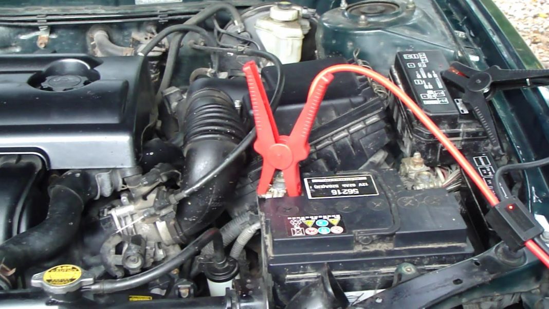 Jumper cable in place for boost starting a car.
