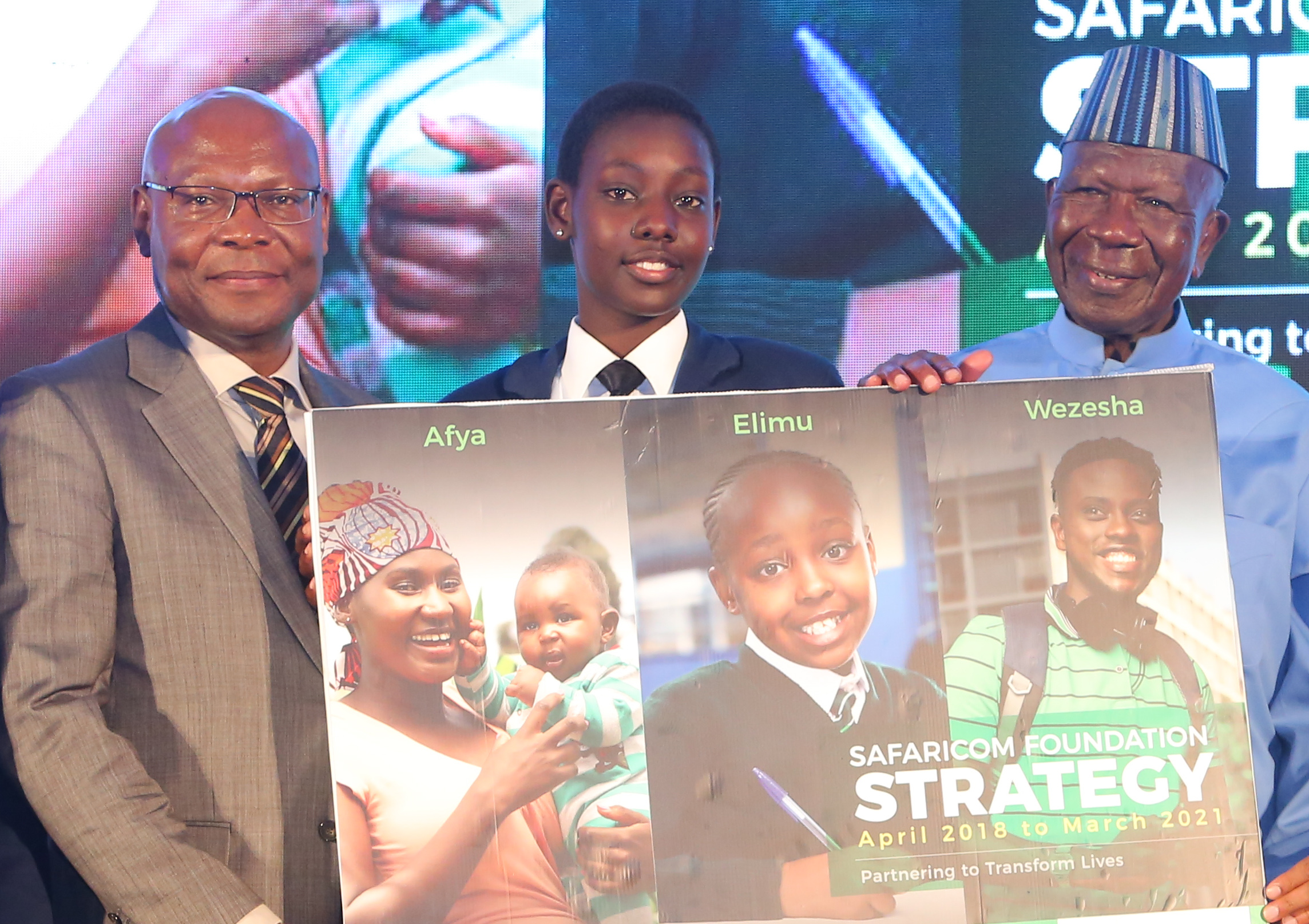Safaricom Foundation Chairman, Joseph Ogutu is joined by Electine Akiru of the M-Pesa Foundation Academy and Safaricom Foundation Goodwill Ambassador, Hon. Moody Awori to mark the unveil of the Safaricom Foundation 2018-2012 Strategy - Bizna