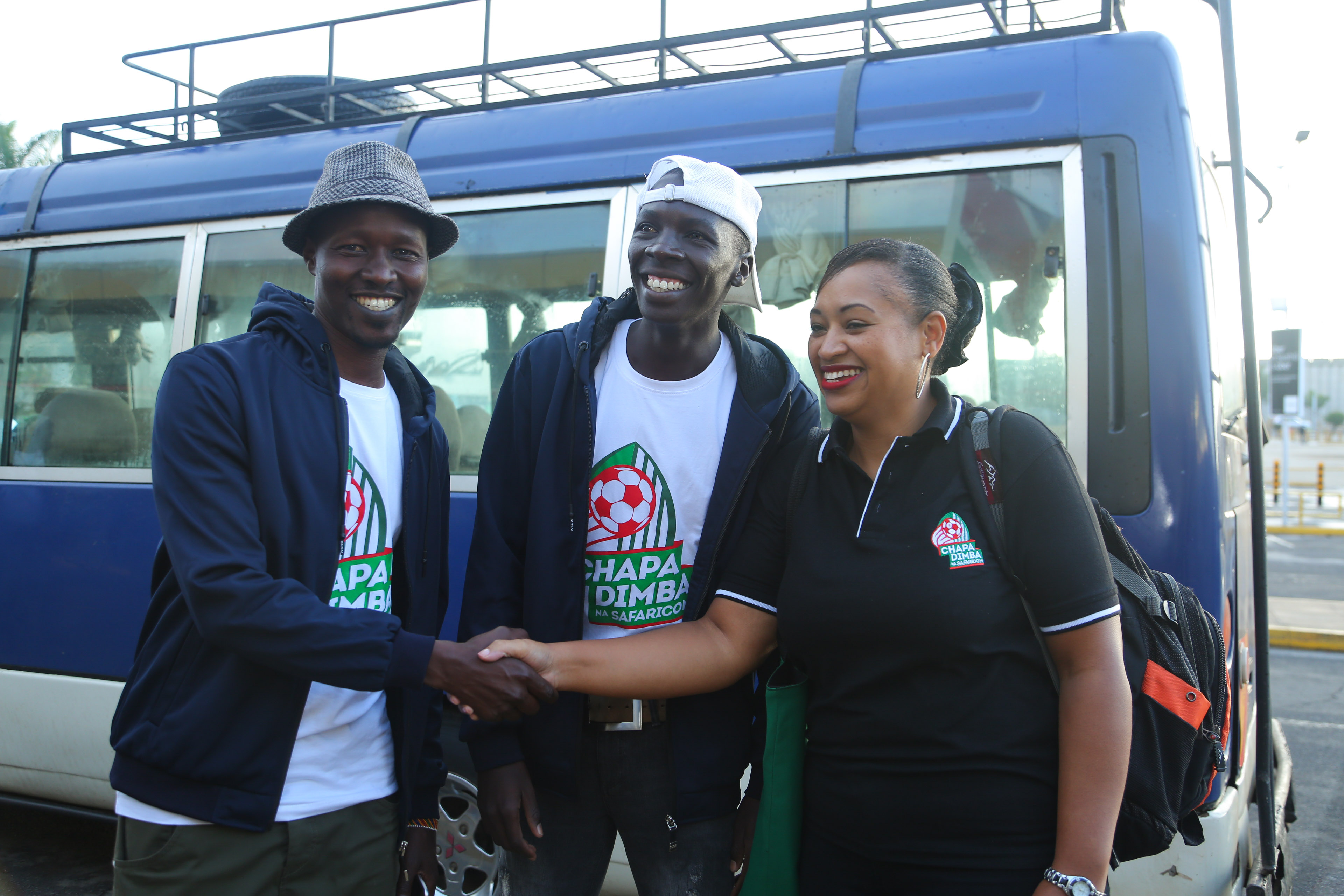 Kapenguria Heroes team manager Kenneth Mnang’at alongside one of his players Beko Gilbert receive last journey bids from Latifa Maredith of EXP Agency, before their check-in for their travel to London at the Jomo Kenyatta International Airport - Bizna