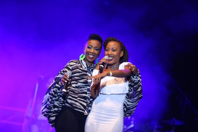 Gospel artist Wahu on stage together with Immaculate Kaimuri the winner of the Twaweza local talent auditions, at the Safaricom Twaweza Live concert held at Kinoru stadium in Meru.