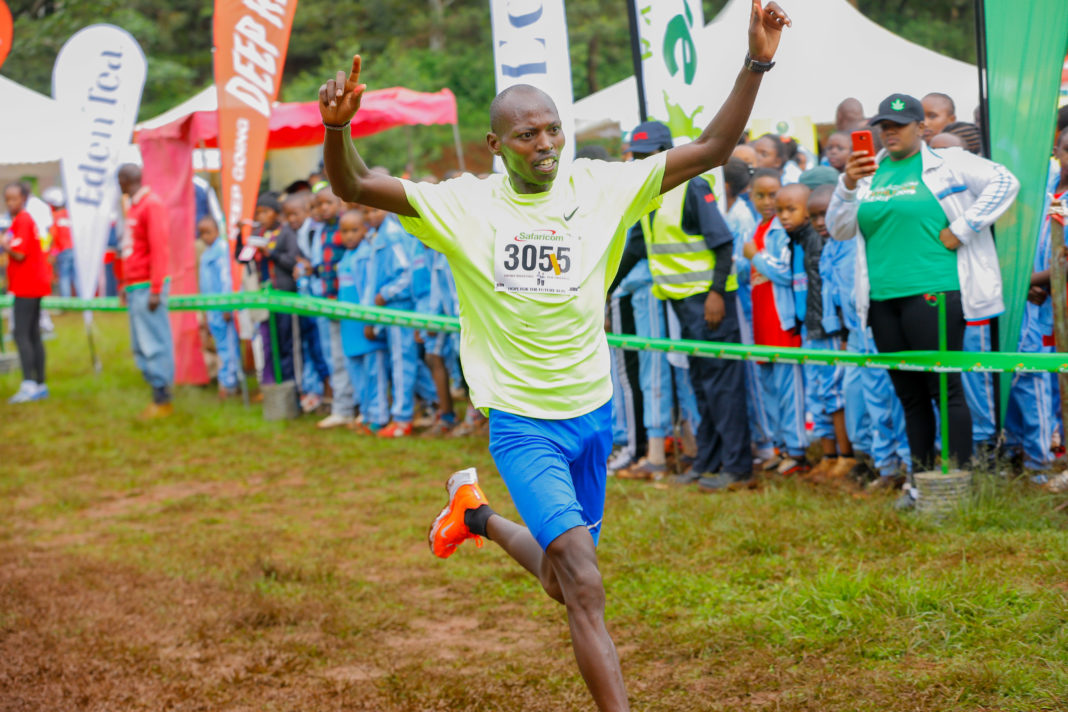 Michael Kunyuga crosses the finish line to win the men’s senior race during The Henry Wanyoike Hope for the future run at Alliance High School grounds in Kikuyu. - Bizna Kenya.