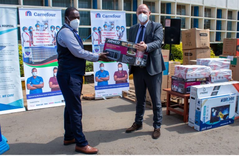 Carrefour Country Manager East Africa : Franck Moreau presenting donations to the CEO Kenyatta National Hospital : Evanson Kamuri with an assortment of household appliances, electronics , face shields and food items to support the healthcare workers during the Covid-19 pandemic - Bizna