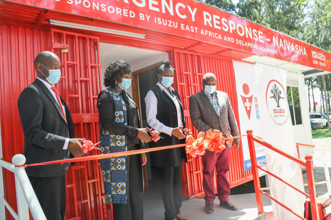 (L-R) Dr. George Ndichu, Representative, Naivasha Sub County hospital; Lucy Njuguna, Managing Director, Nurse In Hand; Rita Kavashe, Managing Director, Isuzu East Africa; George Ngao, Director General, National Transport and Safety Authority (NTSA); cutting a ribbon during the official launch of the first Northern Corridor Highway Emergency Response Center. The Center, which is the first of its kind in Kenya is designed to provide a base where paramedics can be deployed rapidly to accident spots and save lives before evacuation to the nearest hospital, for road users along the busy Nairobi - Nakuru highway - Bizna Kenya