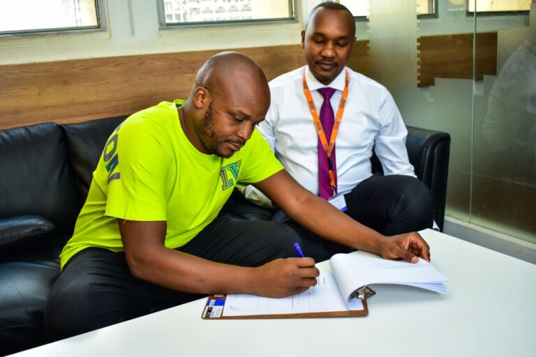 Mwananchi founder and CEO Dennis Mombo with Felix Odiwuor aka Jalang’o during the signing of the brand ambassador agreement - Bizna Kenya