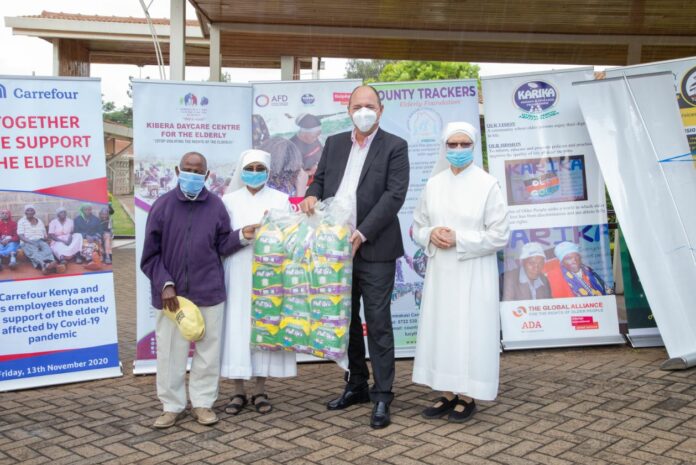 Franck Moreau, Country Manager of Carrefour Kenya at Majid Al Futtaim Retail handing over donation to Mzee Joseph Mujoka (first left), Sr. Teresiah of Jesus & Sr. Antony of Mary (right), all of Nyumba ya Wazee at the Little Sisters Of The Poor, Nairobi - Bizna Kenya