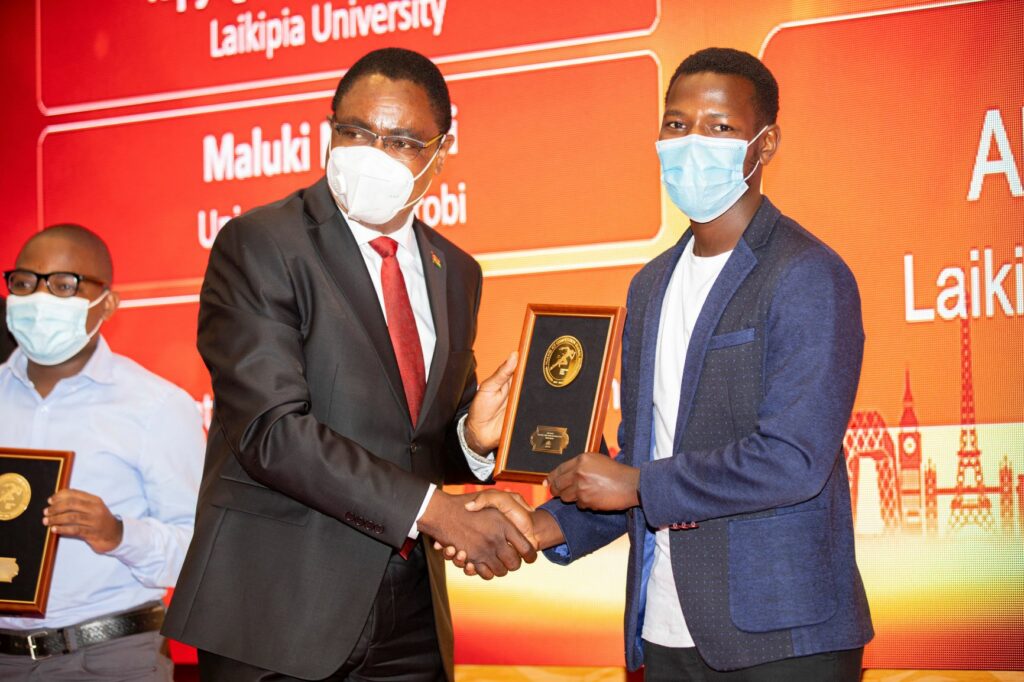 Amb Nabukwesi giving an award - Global ICT Competition - Bizna Kenya