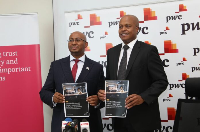 Muniu Thoithi, Partner and Advisory Services Leader, East Africa region, PwC and Peter Ngahu, Eastern Africa Region Senior Partner, PwC Kenya pose during a past event - Bizna Kenya