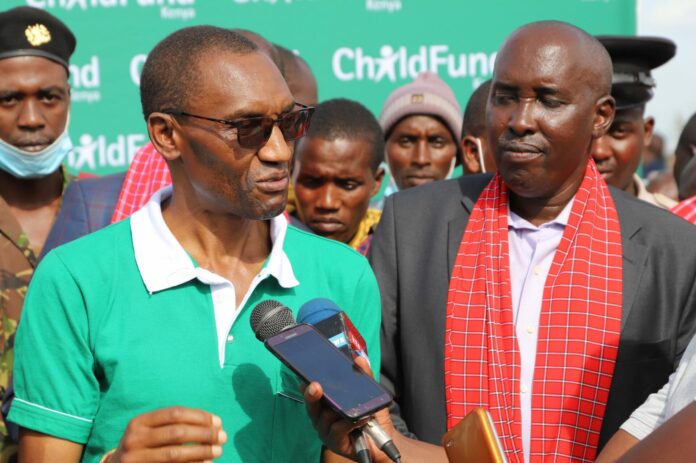 ChildFund Country Director Chege Ngugi (left) and Kajiado County Governor Joseph ole Lenku speak after the launch of the Masimba Milk Processing Plant in Emali - Bizna Kenya