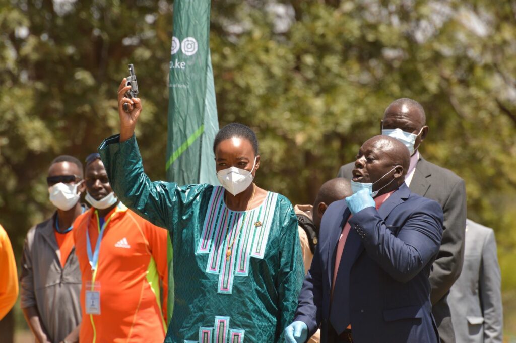 Cabinet Secretary for Defence Dr. Monica Juma fires the starter’s gun to start the main event being the 10 km men’s race at this year’s KDF Annual Cross-country Championships held at Moi Airbase in Eastleigh Nairobi on Friday 29 January 2021 - Bizna Kenya