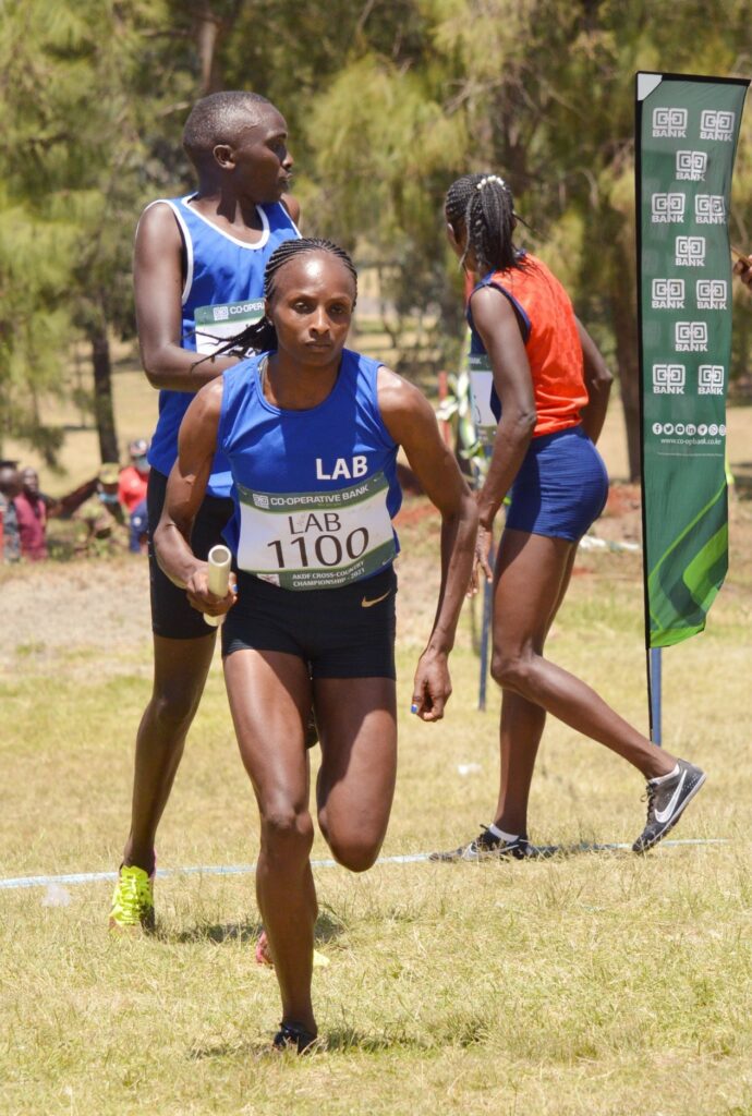 Double World Champion in both the 5,000m and also Cross-country Hellen Obiri of Laikipia Air Base races with the baton in the relay event. She won the 10 km women race at this year’s KDF Annual Cross-country Championships held at Moi Airbase in Eastleigh Nairobi on Friday 29 January 2021 - Bizna Kenya