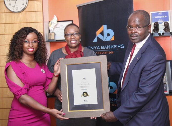 Monica Chege, Credit Bank's Senior Manager, Marketing and Communications (left), and Credit Bank's Contact Centre and Customer Experience Manager, Judith Wanjala (centre), receive the 1st Place - Best in Tier 3 certificate Kenya Bankers Association's CEO, Dr Habil Olaka, during the unveiling of KBAs Customer Satisfaction Survey. For the third year running, Credit Bank was voted Best in Tier 3 in Customer Responsiveness and Digital Experience - Bizna Kenya