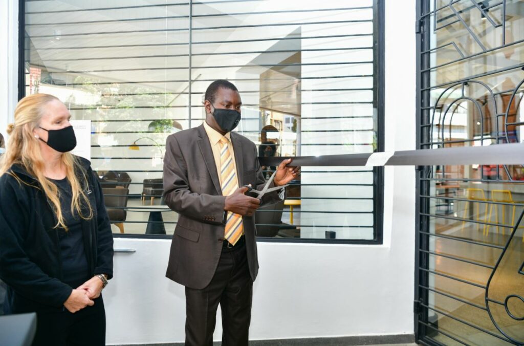 Uasin Gishu County Governor Hon. Jackson Mandago cuts the ribbon during the official opening of Kikao64 in Eldoret town. Looking on is Elisabeth Klem, VWT Executive Director - Bizna Kenya