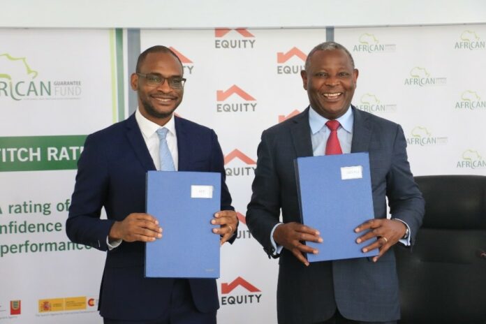 Jules Ngankam, CEO, African Guarantee Fund (left) and Dr. James Mwangi, MD & CEO, Equity Group Holdings Plc display signed partnership agreement. Equity Group Holdings has signed a partnership agreement with African Guarantee Fund for a guarantee facility of Ksh. 8.25 Billion shillings to ensure Equity can support businesses on the path to recovery as they get back to their normal operations - Bizna Kenya