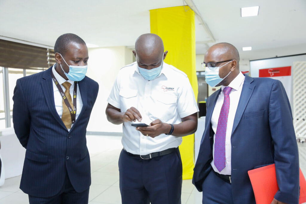 The Managing Director of National Bank of Kenya, Paul Russo (right) with Amref Flying Doctors CEO, Stephen Gitau during the launch of Maisha Cover Emergency Service in partnership with Amref Flying Doctors. Looking on is NBK's Head of Change Management, Fred Kioko - Bizna Kenya