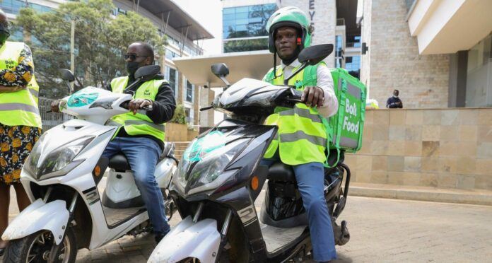 Bolt Food couriers display the e-bikes that have been introduced by Bolt as the company seeks to expand its green transport options in Kenya - Bizna Kenya