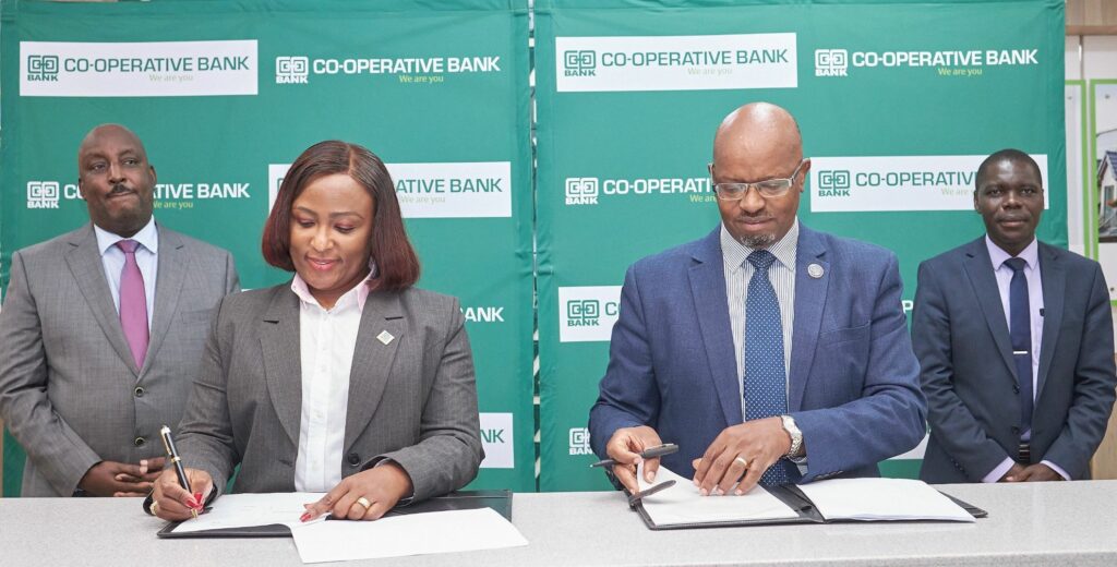 Jacquelyne Waithaka - Director, Corporate and Institutional Banking at Co-op Bank and Peter Waiyaki - Board Chair, Enwealth Financial Services Limited, sign a partnership agreement to launch the Pension-backed Mortgage Loan at Co-op Bank’s Property Hub in Nairobi. Looking on are Head of Mortgage Finance at Co-op Bank Chris Chege (extreme left) and Simon Wafubwa, Managing Director, Enwealth Financial Services Limited - Bizna Kenya
