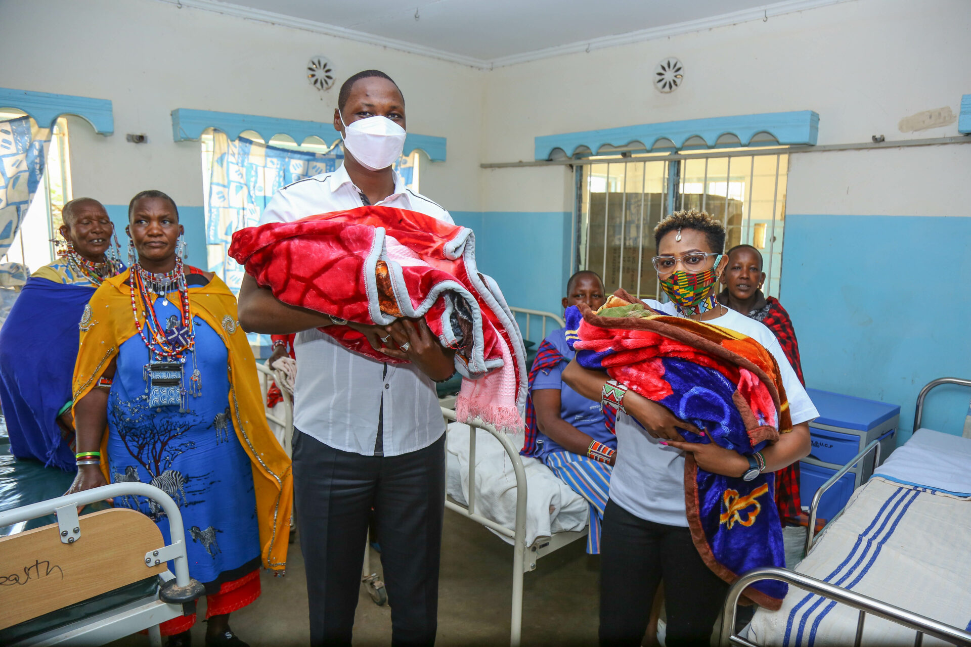 Deputy Governor Kajiado County, Martin Moshisho (3L) and Safaricom PLC’s Martha Kimondo (R) in the maternity ward at Bissil Health centre in Kajiado County during the official handover of a newborn incubator, hospital beds, suction machine and Oxygen Concentrator donated by Safaricom Foundation’s Ndoto Zetu initiative which is in its third phase. Over one million Kenyans are expected to benefit from Safaricom Foundation’s Ndoto Zetu Initiative - Bizna Kenya