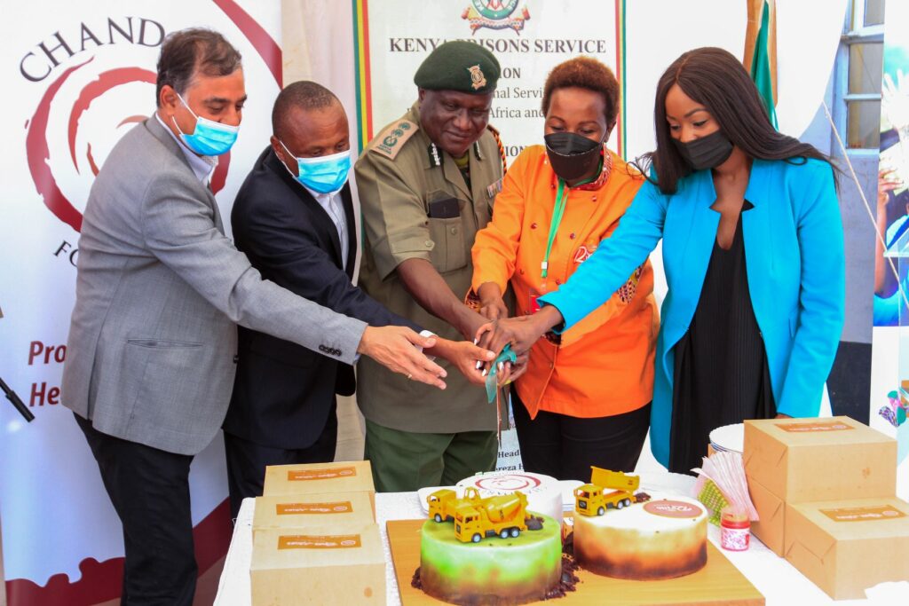 (L-R) Manish Mehra, Business Head MRM, Vincent Rapando, Chandaria Foundation Representative, Mr. Wycliffe Ogallo CBS Commissioner General of Prisons, Rina Nzove Director Rina House and Wambui Kahara Regional Focal Point on Youth & Urban Coordinator, UNODC cut a cake during the official ground breaking ceremony of the clothing, textile and bakery workshop unit at the Lang’ata Women’s Prison - Bizna Kenya