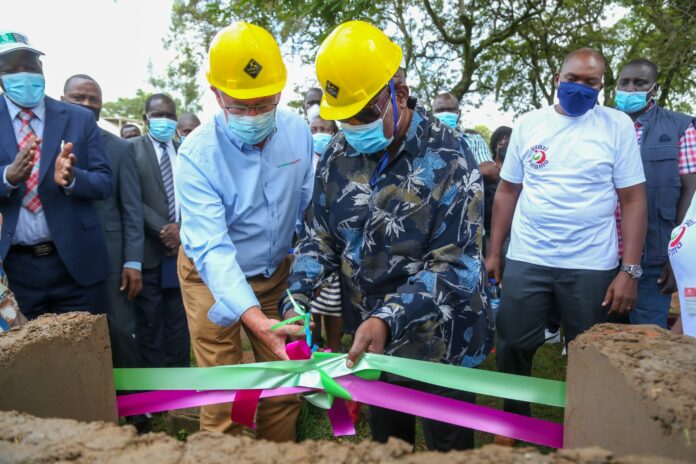 MPESA Foundation Mr. Les Baillie(left)Chief Executive Officer and Governor, County Government of Homabay H.E. Hon. Cyprian Awiti cut the ribbon during the official groundbreaking of the Maternity Unit to Ndhiwa Sub County Hospital through the Uzazi Salama Project. Uzazi Salama project is a partnership between M-PESA Foundation, Pharm Access Africa, AMREF Health Africa, Action Aid, Pathfinder international and Homabay County Government, that will strengthen the county’s health systems to support the delivery of quality reproductive, maternal, new-born, child and adolescent healthcare. The event was held at Ndhiwa Sub County Hospital Homabay County - Bizna Kenya