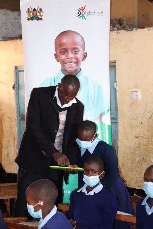 Mr. Erick Chirchir, a teacher at Bosto Primary school in Bomet county, takes a pupil through learning using a mobile device introduced to schools through Digital Literacy Program integrated into the curriculum to spur digital learning. The launch of the Schoolnet connectivity in partnership with Huawei will greatly boost internet connectivity to schools less than 1km from NOFBI using fiber, and use microwave point-to-point for schools within 10km radius - Bizna Kenya