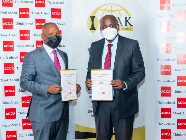 ACCA Head of Market Dvpt Africa(R)George Njari &ICPAK CEO Edwin Makori display the partnership agreement between the two entities that will enhance member benefits and increase access to learning resources - Bizna Kenya