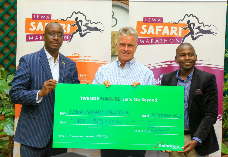 Chief Human Resources Officer Safaricom PLC Paul Kasimu (L) pose with a dummy cheque for Kshs. 10 Million to support the Lewa Safari Marathon as Mike Watson(C),CEO Lewa Wildlife Conservative and John Kinoti(R) Community Development Manager Lewa Marathon. This was during the Official Launch of the Lewa Safari Marathon 2022 and cheque handover at Sarova Stanley Nairobi today - Bizna Kenya