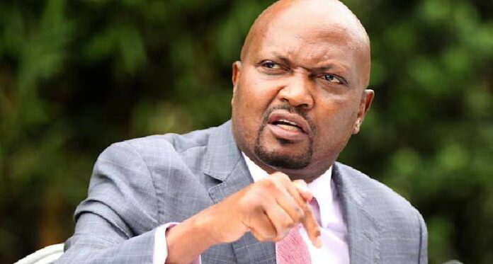 How educated is Moses Kuria