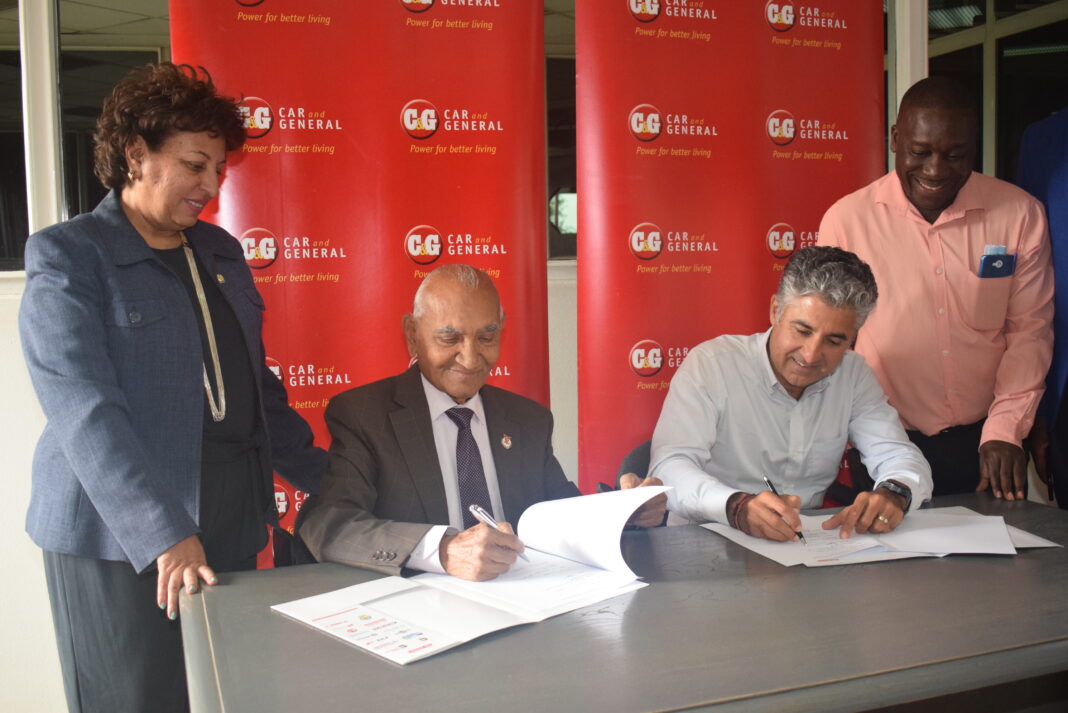 Vijay Gidoomal (second right) CEO of Car and General Trading Limited and Dr. Manilal Dodhia (second left) , Chairman, Lions SightFirst Eye Hospital (LSEH) sign a Memorandum of Understanding for the provision of free eye camps across the country. The agreement was witnessed by Rizwana Peerbhoy (left), the LSEH General Manager and Raphael Atanda (right), the Car and General Head of Marketing - Bizna Kenya.