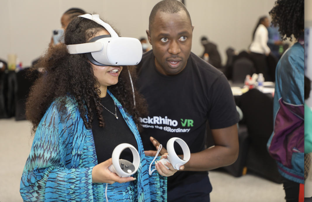 BlackRhino VR representative taking a participant through the VR experience during the Meta Youth Summit - Bizna Kenya