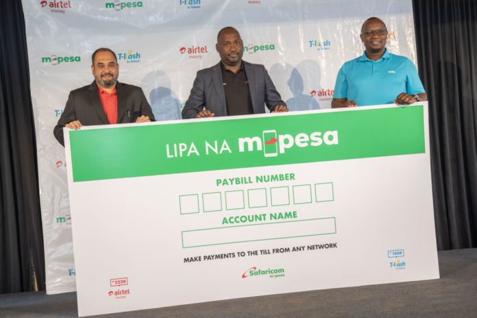 From left, Airtel Networks Kenya CEO - Ashish Malhotra, Safaricom PLC Interim Chief Financial Services - Boniface Mungania and Telkom Kenya Chief Strategy and Business Development Officer - Julius Cheptiony during the launch of Merchant Interoperability Paybill - Bizna Kenya