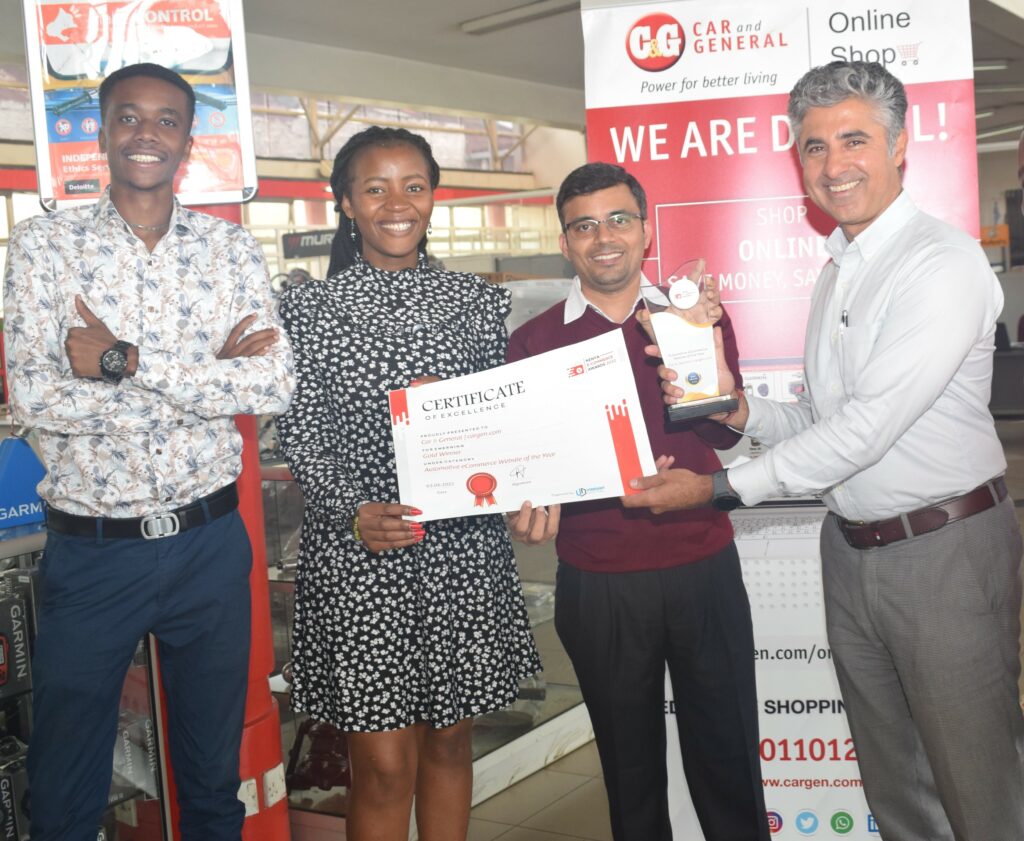 After Car and General won the prize for best in Automotive E-commerce at the annual E-commerce Awards function (right-left) CEO Vijay Gidoomal, Head of Digital Sales and Marketing Saumil Vyas, Digital Marketing Executives Pollet Mungai and Joseph Kiama celebrate with the certificate - Bizna Kenya