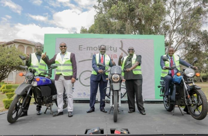 From left, Chairman &. Founder, Boda-boda safety Association of Kenya, Kevin Mubadi , KCB GCEO, Paul Russo, , Director, Ministry of Industrialization, Stephene Oduor, UNITAR Representative, Pius Masinde and Deputy Governor, Kajiado County, Moshisho Martine. This was during the E-mobility launch of electronic motorbikes at KCB Leadership Centre in Karen, Nairobi - Bizna Kenya