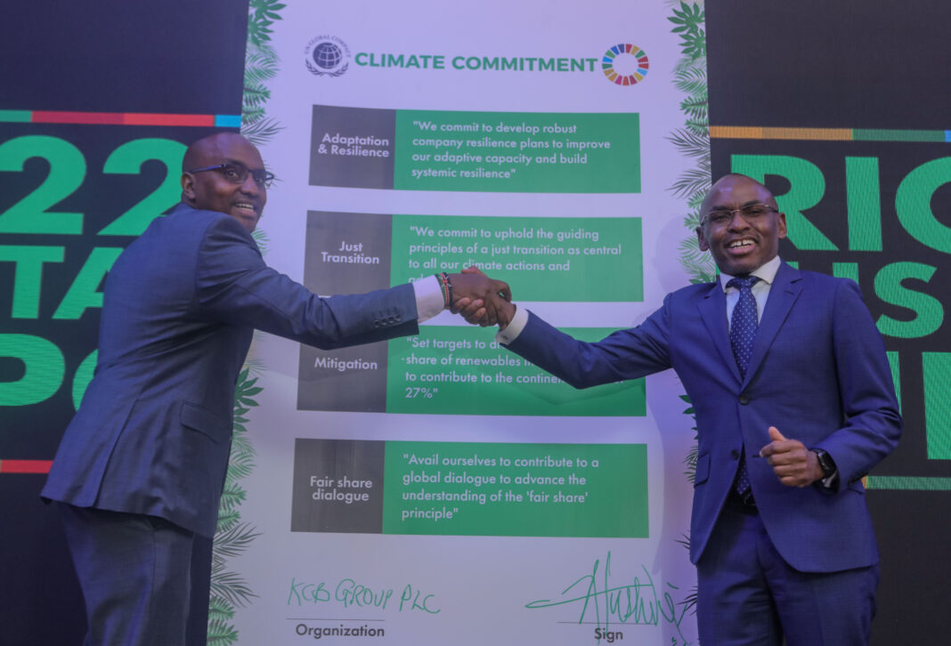 KCB Group CEO Paul Russo left, together with Safaricom PLC CEO Peter Ndegwa after signing the climate commitment act at the Michael Joseph Centre today during the Safaricom Sustainable Business report launch - Bizna Kenya