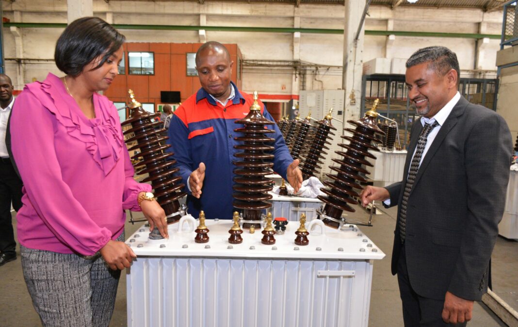Mrs. Phyllis Gachau, Group Head of Strategy, Corporate Affairs & Investor Relations, TransCentury PLC (L) Eng. Jeremiah Mabula, Production Superintendent, Tanelec Limited (centre) and Mr. Zahir Saleh, Group Chief Executive Officer, Tanelec Limited during the factory visit in Arusha, Tanzania - Bizna Kenya