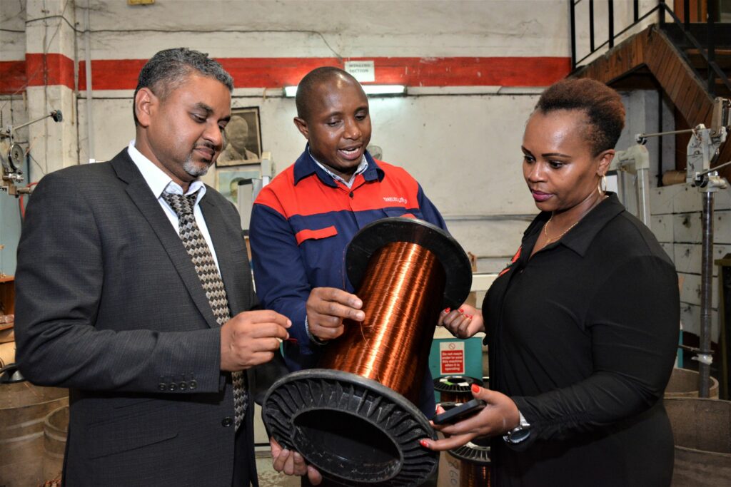 Mr. Zahir Saleh, Group Chief Executive Officer, Tanelec Limited (L) Eng. Jeremiah Mabula, Production Superintendent, Tanelec Limited (centre) and Ms. Evelyne Wanjiku, Human Resource & Administration Manager, TransCentury PLC during the factory visit in Arusha, Tanzania - Bizna Kenya