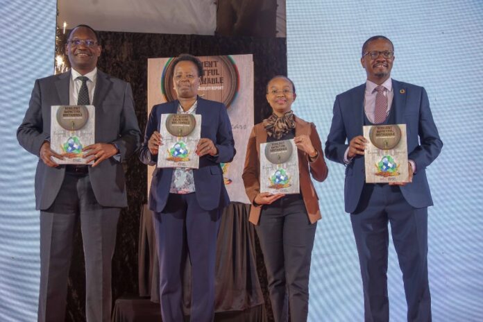 Octagon Africa Financial Services Representatives General Manager-Marketing Business and Product Development Davis Ongiro, Brand and Communications Officer Elizabeth Wanja, Commercial Director Florence Muchiri and Group CEO Fred Waswa(second right) pose for a photo with Habib Bank CEO Asim Basharullah after receiving a trophy in recognition of their efforts in digital transformation during the 2022 Kenya Top 100 Mid-Sized Companies Award Gala at the Safari Park Hotel - Bizna Kenya (Publisher)