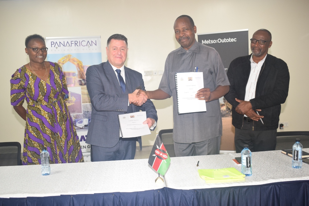 Charles Green (second left), the Panafrican Equipment Group Training Manager, and Eng. Maurice Nabende (second right), the Director of Kenya Institute of Highways and Building Technology (KIHBT) exchange a cooperation agreement for training of instructors and students. It was witnessed by Geoffrey Githiri (right) KIHBT Deputy Director and Iris Masidza (left) Panafrican Equipment Group Training Coordinator - Bizna Kenya (Publisher)