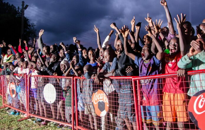 Kisumu residents celebrate one of the team scorings during Coca-Cola World Cup viewing in Kisumu County - Bizna Kenya (Publisher)