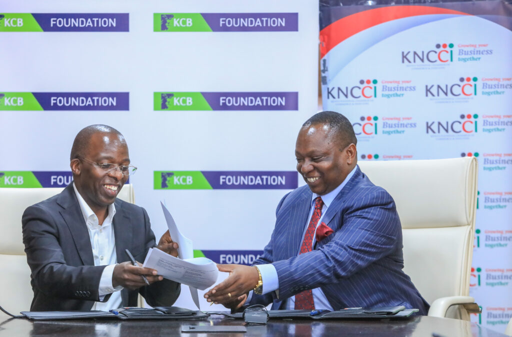 (L to R) Chief Commercial Officer, KCB Group, Sam Makome and KNCCI President Richard Ngatia sign an MOU toward supporting MSMEs and corporations in the country to access financial and non-financial services through the KCB Bank and KCB Foundation - Bizna Kenya (Publisher)