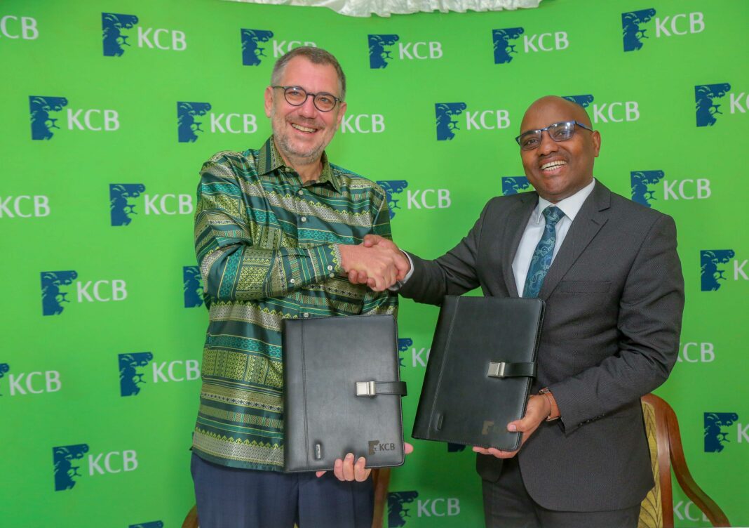 (R-L) KCB Group CEO Paul Russo and Trust Merchant Bank SA (TMB) Oliver Meisenberg exchanging the transaction agreement documents during the final sign-off ceremony event. KCB Group Plc has completed the acquisition of TMB after receiving all the regulatory approvals. KCB Group CEO Paul Russo said the transaction will positively contribute towards KCB’s increased scale of operations by establishing its presence in new markets and providing income diversification from a geographical perspective.