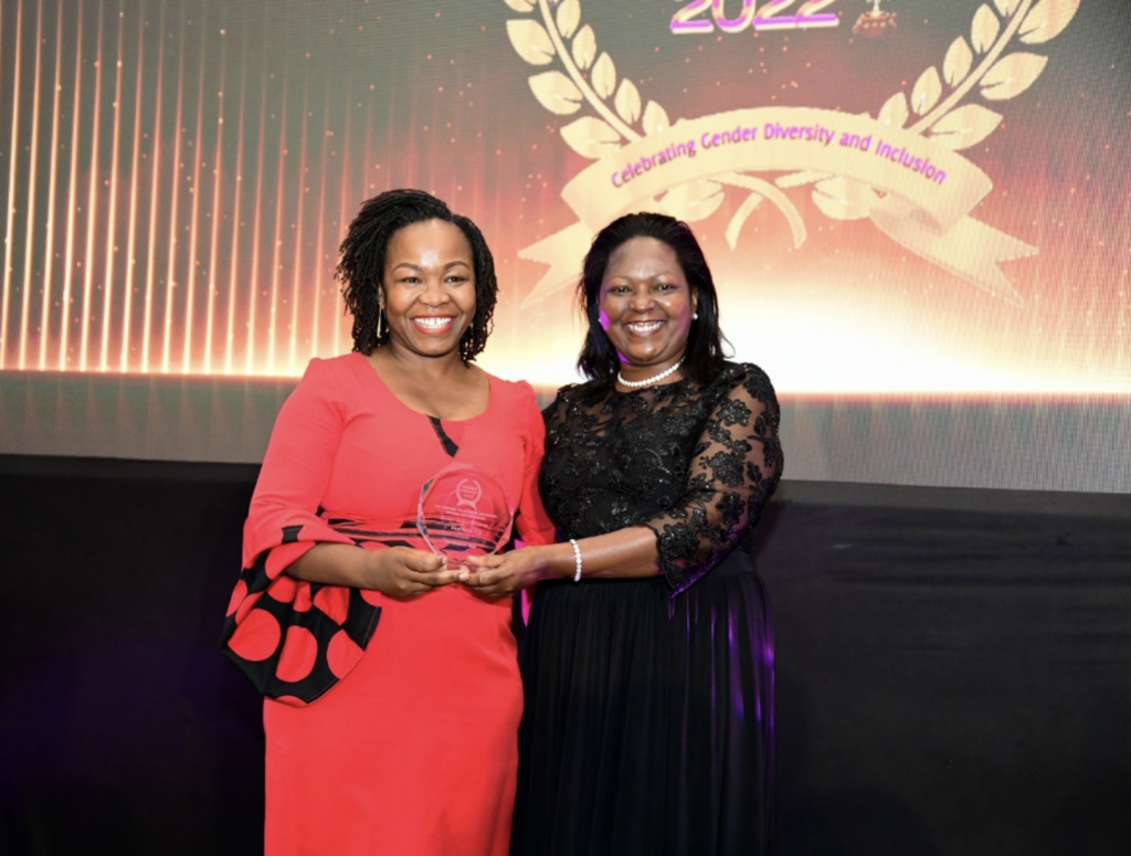 Equity Group Executive Director Mary Wamae (R) presents a trophy to the first runner-up of the 2022 Overall Women on Boards Award, KEPSA Director of Health & Social Services and Kenya Healthcare Federation Vice Chair, Dr. Elizabeth Wala (L) - Bizna Kenya (Publisher)