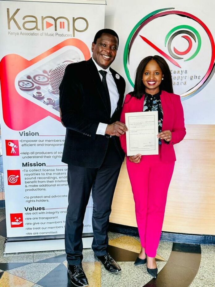 KAMP Chairperson Angela Ndambuki and CEO Morris Okoth showcases KAMP CMO Operating License - Bizna Kenya (Picture Courtesy)