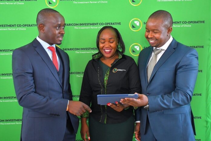 Safaricom Investment Co-operative Chairman Peter Gichangi (L), CEO Sarah Wahogo and Board member Edward Njoroge share a light moment during the Society’s 14th Annual General Meeting where the shareholders approved a KES176.9 million dividend payout - Bizna Kenya (Picture Courtesy)