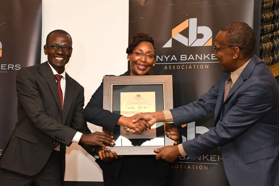 WINNERS! The Co-op Bank duo of Head of Digital Payment Services Chris Cheruiyot and the Head of Customer Experience Rose Nyamweya receive the certificate of Overall Winner of the Customer Satisfaction awards of the Kenya Bankers’ Association (KBA) from the Communications and Public Affairs Director of KBA Fidelis M. Muia. Co-op Bank was voted by customers the best in customer experience from among all the 40 KBA member banks - Bizna Kenya (Picture Courtesy)